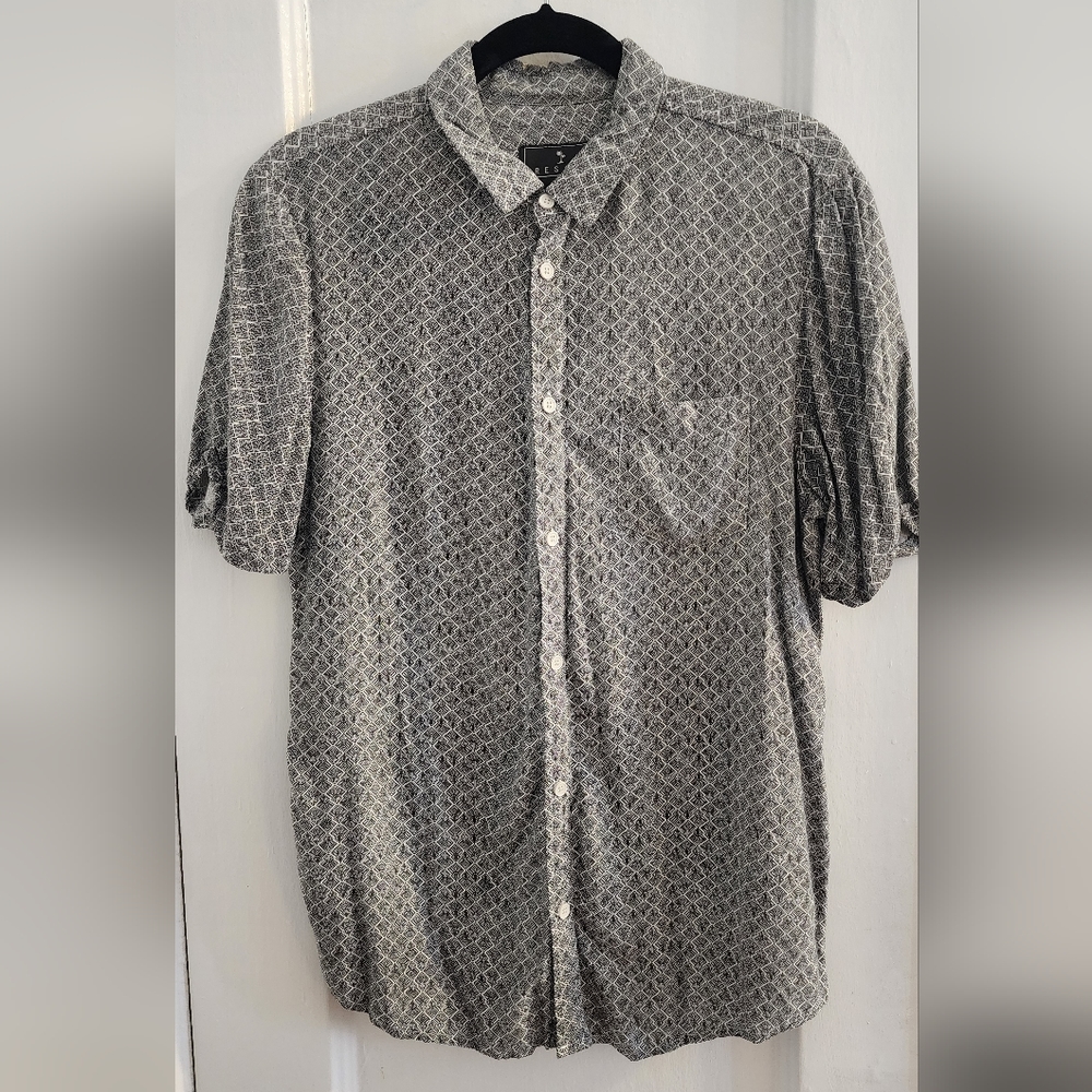 Resort short-sleeve button down with cuffed sleeves.